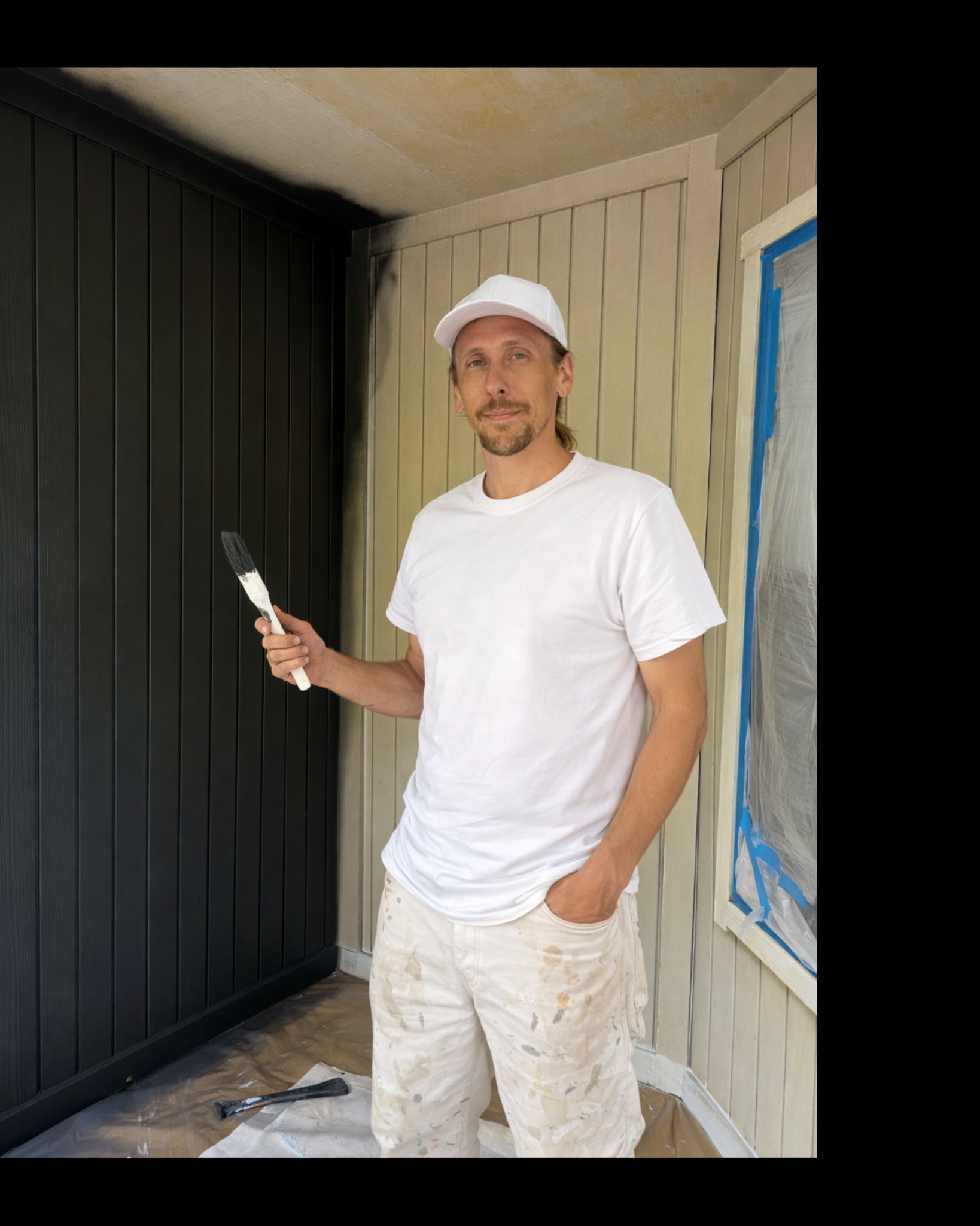 Chris painting a home